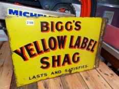 A DOUBLE SIDED ADVERTISING SIGN FOR BIGG'S YELLOW LABEL SHAG, LASTS AND SATISFIES!!