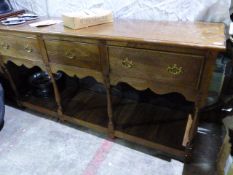 A GEO.III.STYLE COUNTRY OAK POT BOARD DRESSER BASE WITH THREE DRAWERS. W.180 x H.87cms.