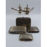 A PAIR OF VICTORIAN SILVER PLATED TABLE CIGAR LIGHTERS TOGETHER WITH A FOUR DIVISION SILVER CIGAR