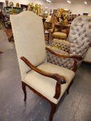 AN ANTIQUE CARVED WALNUT FRENCH PROVINCIAL HIGHBACK ARMCHAIR WITH SCROLL ARMS AND CABRIOLE LEGS.