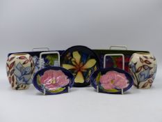 TWO MOORCROFT RECTANGULAR POTTERY DISHES. 20 x 9cms. A PAIR OF BALUSTER VASES. H.9cms. TWO OVAL