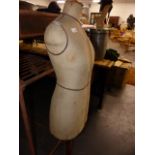 AN ANTIQUE DRESSMAKER'S FORM.