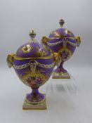 A PAIR OF DRESDEN PORCELAIN TWO HANDLED PEDESTAL VASES WITH COVERS. H.21cms.