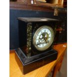 A VICTORIAN BLACK SLATE MANTLE CLOCK WITH VISIBLE ESCAPEMENT. H.26cms.