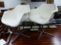 A PAIR OF ROBIN DAY, HILLE SWIVEL ARMCHAIRS ON CHROME BASES.