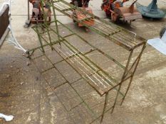 A WROUGHT IRON THREE TIER STEPPED PLANT STAND.