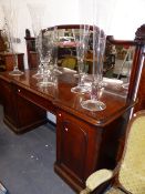 A VICTORIAN MAHOGANY TWIN PEDESTAL MIRROR BACK SIDEBOARD WITH CENTRAL DRAWER AND FITTED CUPBOARDS.