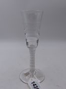 A 19th.C. DRINKING GLASS WITH ELONGED BOWL AND WHITE OPAQUE SPIRAL AIR TWIST STEM. H.17cms.