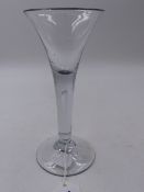 A 19th.C. DRINKING GLASS WITH TRUMPET BOWL AND TEAR GLASS STEM. H.16cms.