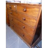 A VICTORIAN MAHOGANY CHEST OF DRAWERS.