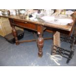 AN OAK DRAW LEAF TABLE.