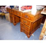 A TWIN PEDESTAL DESK.