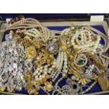 A SELECTION OF VINTAGE AND LATER ORNATE COSTUME JEWELLERY.