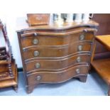 A MAHOGANY SERPENTINE FRONT CHEST OF FOUR LONG DRAWERS WITH BRUSHING SLIDE