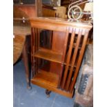 AN EDWARDIAN REVOLVING BOOKCASE.