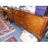 A LARGE QUEEN ANNE STYLE WALNUT SIDEBOARD.