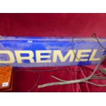 A DREMMEL ADVERTISING SIGN.