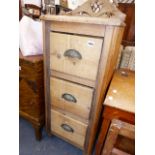 A SMALL PINE THREE DRAWER CHEST.