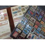 A COLLECTION OF POSTCARDS, STAMPS, AND CIGARETTE CARDS, BOOKS, ETC.