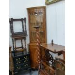 A YEW WOOD CORNER CABINET AND A TORCHERE.