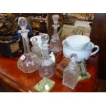 TWO ANTIQUE JELLY MOULDS, FIVE DECANTERS,ETC.