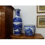 A LARGE BLUE AND WHITE BOWL AND A VERY LARGE BLUE AND WHITE VASE.