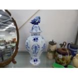 A DELFTWARE LIDDED VASE WITH COVER.