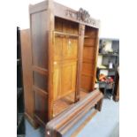 A FRENCH CARVED OAK WARDROBE.