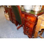 A MODERN MAHOGANY DESK AND MATCHING SWIVEL CHAIR.