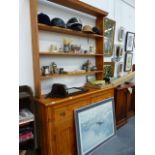 AN ANTIQUE PINE DRESSER.