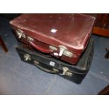 THREE VINTAGE SUITCASES.