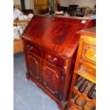 A MODERN MAHOGANY BUREAU.