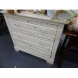 A PAINTED CHEST OF DRAWERS.