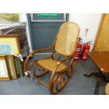 A BENTWOOD ROCKING CHAIR.