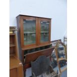 A MAHOGANY CABINET ON STAND.