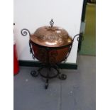AN ARTS AND CRAFTS COPPER AND WROUGHT IRON COAL BIN.