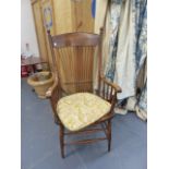 AN ARTS AND CRAFTS SPINDLE BACK ARMCHAIR.