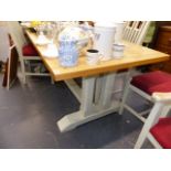 A GOOD QUALITY BEECH TOP KITCHEN TABLE ON PAINTED TRESTLE BASE.