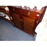A HARDWOOD SIDE CABINET WITH FITTED WINE RACK AND GLASS HANGERS