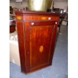 A GEORGIAN MAHOGANY AND INLAID CORNER CABINET.