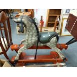 AN ANTIQUE STYLE ROCKING HORSE.