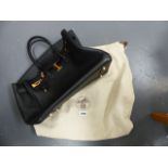 A HERMES PARIS STYLE BLACK LEATHER BAG WITH DUST BAG.