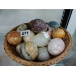 A COLLECTION OF HARD STONE EGGS.