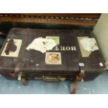 A LEATHER SUITCASE.