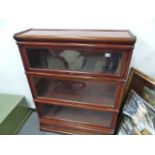 A MAHOGANY GLOBE WERNKE BOOKCASE.