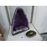 AN AMETHYST GEODE AND AN AGATE SLICE.