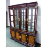 A LARGE ORIENTAL STYLE BREAKFRONT DISPLAY CABINET.