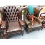 TWO LEATHER WING BACK ARMCHAIRS AND A SIMILAR STOOL.