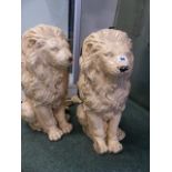 A PAIR OF ANTIQUE WELL CAST RECONSTITUTED STONE LION FORM GATEPOST FINIALS.