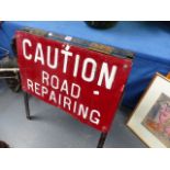 A VINTAGE ROAD SIGN.